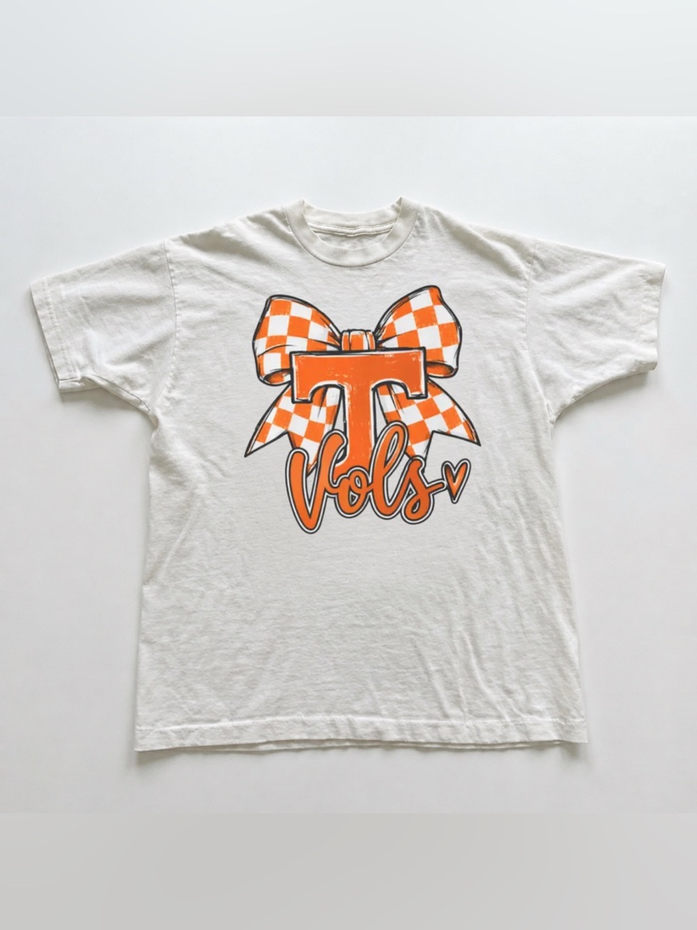White Tee with Orange 'T' and Checkered Bow Graphic